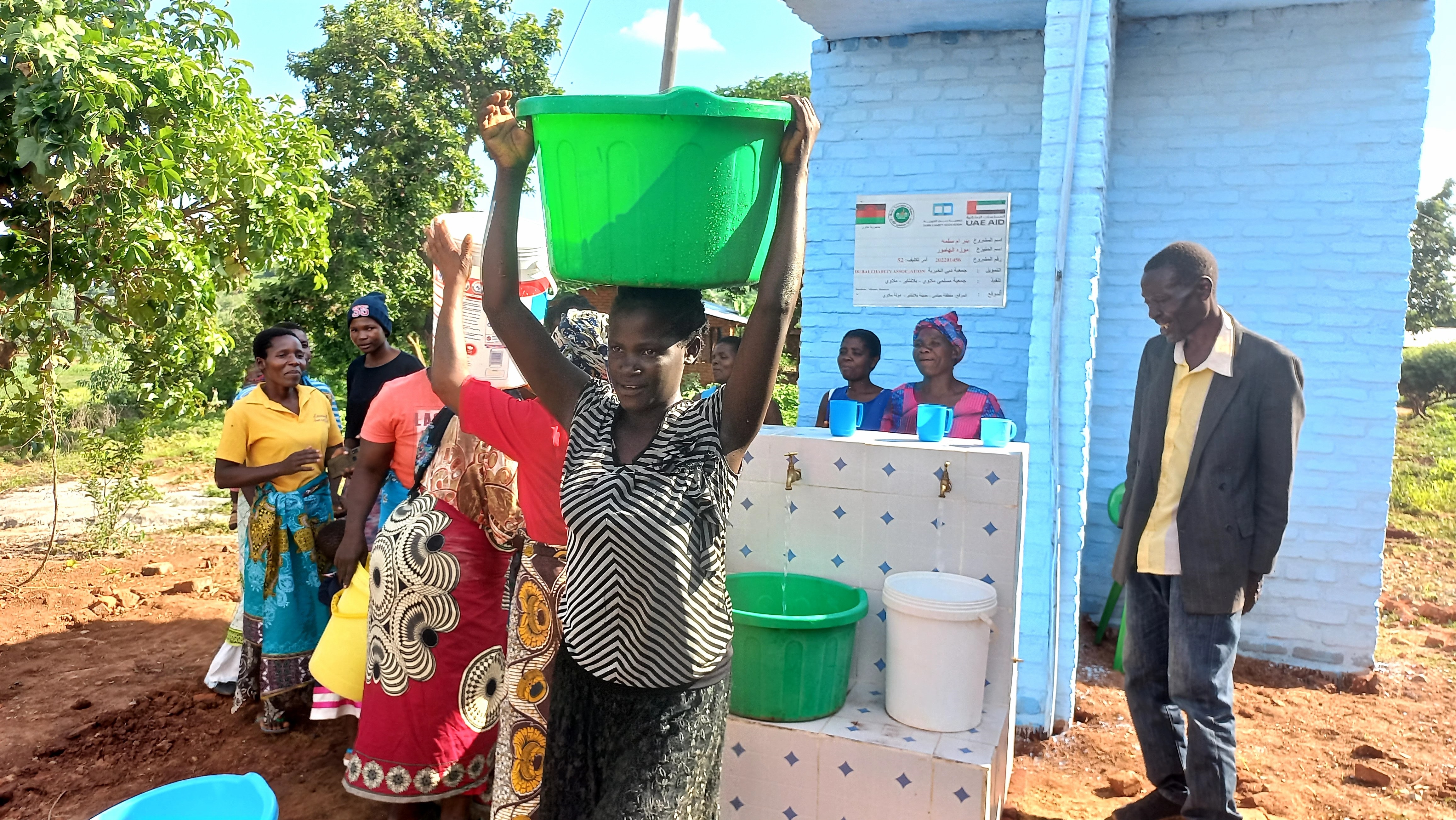 MAM hands over electric powered water taps and a borehole